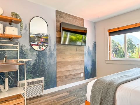 Designer Room, 1 King Bed, Mountain View | Minibar, blackout drapes, WiFi (free), individually decorated
