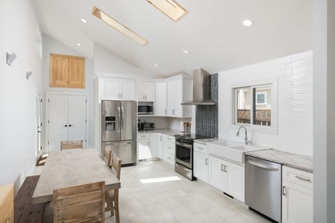 The Bright and Beautiful Kitchen is Large and Perfect for Cooking for a Crowd. 