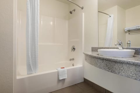 Standard Room, 2 Queen Beds, Non Smoking, Refrigerator & Microwave | Bathroom | Combined shower/tub, hair dryer, towels, soap