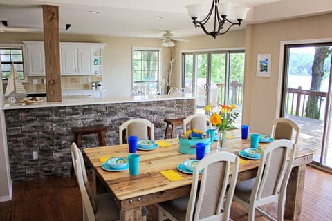 Dining area overlooking deck and lake
