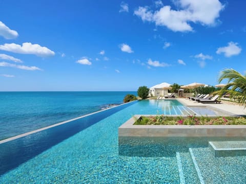 Outdoor pool, open 9 AM to 6 PM, pool umbrellas, sun loungers