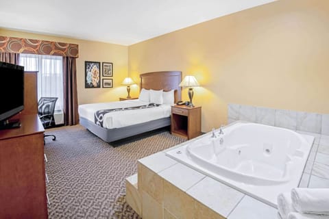 Deluxe Suite, 1 King Bed, Non Smoking | Premium bedding, desk, blackout drapes, iron/ironing board