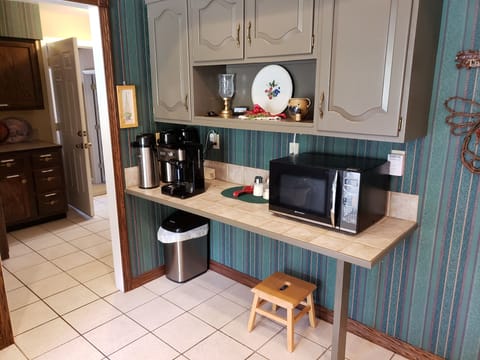 Kitchen coffee bar. Note entrance to Executive Suite rear left in hallway.