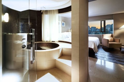 Premium Suite, 1 King Bed | Bathroom | Separate tub and shower, deep soaking tub, hair dryer, bathrobes