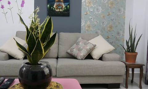 Apartment, 4 Bedrooms | Living room | Flat-screen TV