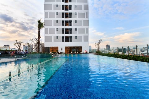Outdoor pool, open 6:00 AM to 9:00 PM, sun loungers