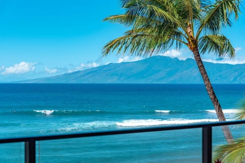 Here, the only thing more inviting than the lanai is the view—rolling surf, sun-drenched sand, and swaying palms