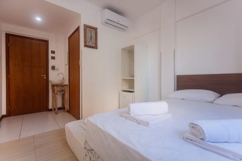 Standard Triple Room | Minibar, blackout drapes, free WiFi, bed sheets
