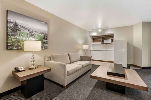 Family Suite, 1 King Bed with Sofa bed, Non Smoking | Desk, laptop workspace, blackout drapes, iron/ironing board