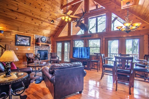 Spacious Living Room with vaulted ceiling and 60" HD smart TV. Secure WIFI