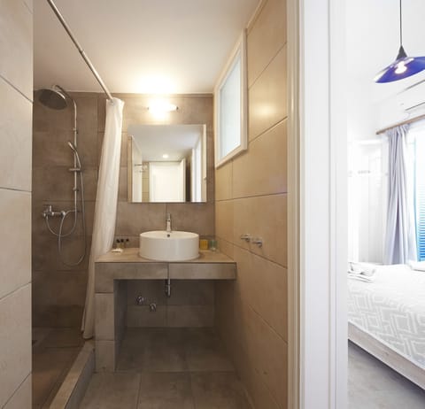 Family Suite, 2 Bedrooms (Side View) | Bathroom | Shower, free toiletries, hair dryer, towels