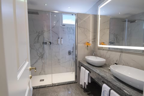 Shower, eco-friendly toiletries, hair dryer, bidet