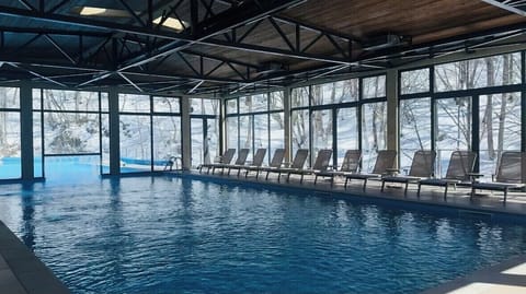 Indoor pool, outdoor pool, open noon to 7 PM, pool umbrellas
