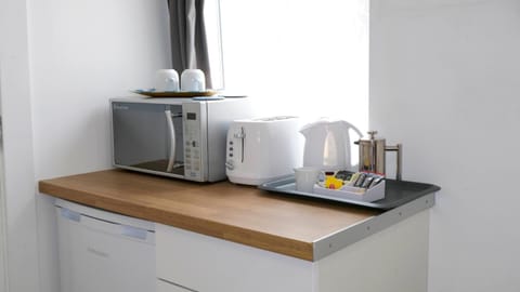 Full-size fridge, microwave, coffee/tea maker, electric kettle