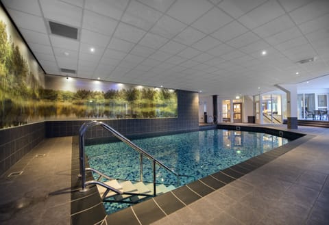 Indoor pool, open 7:00 AM to 11:00 PM, sun loungers