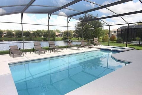 Refreshing private pool with ample seating and a tranquil view of the surroundings.