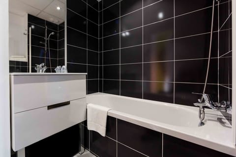 Desk, laptop workspace, blackout drapes, iron/ironing board