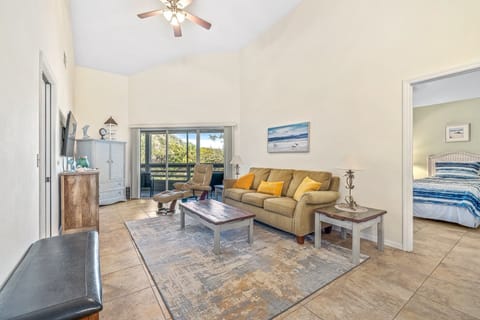Spacious and coastal living room with access to the balcony.