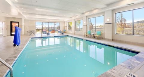 Indoor pool, open 6:00 AM to 10:00 PM, pool umbrellas, sun loungers