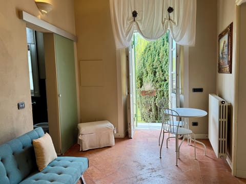 Suite, Garden Area | Living area | Flat-screen TV