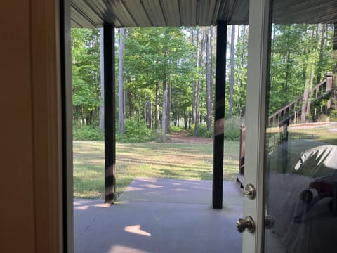 Basement family room opens out to patio and path to the lake.