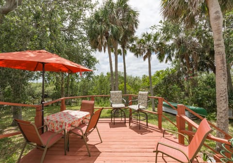 Back of home with deck to enjoy the Florida sun.