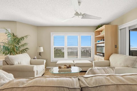 Spacious and well-decorated coastal living room space.