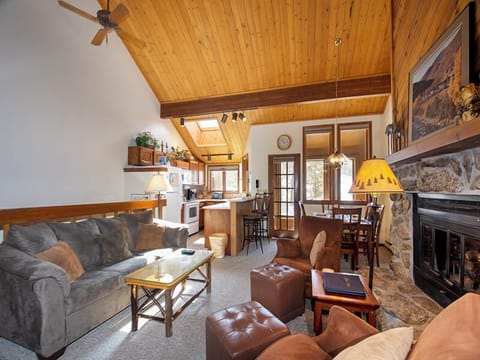 Relax in this cozy mountain retreat with soaring wood ceilings, stone fireplace, and open living space perfect for unwinding after adventures.