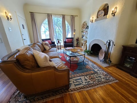 Grand windows let natural light in the inviting and warm living area