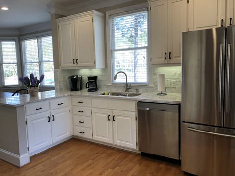 Kitchen renovated with new counters, back splash and appliances.