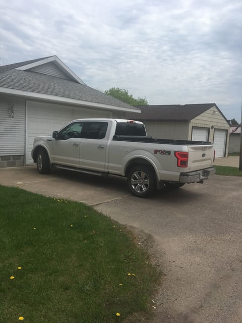You can fit 2 full size trucks in the driveway (next to each other).
