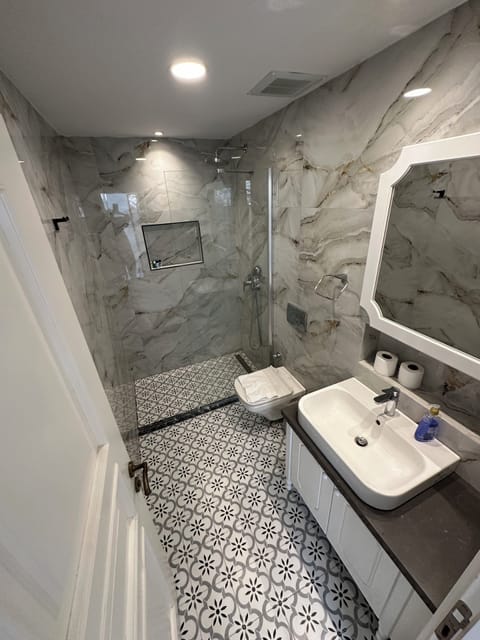 Quadruple Room, Garden View | Bathroom | Shower, free toiletries, hair dryer, slippers