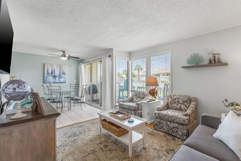 Unwind in your bright, coastal-themed living space with comfortable seating and sliding doors to your private balcony.