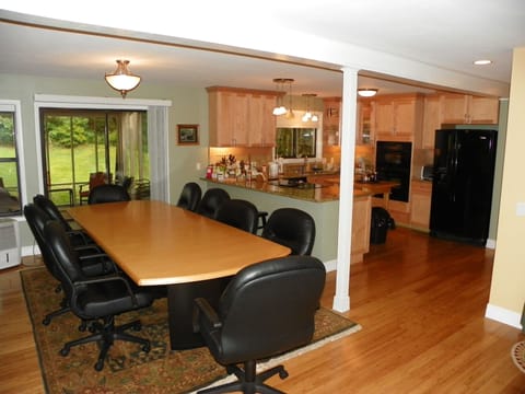 Large table in dining room, kitchen and patio