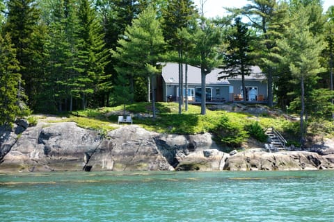 The 'Seaside Sanctuary' perched on granite coastline nestled in the trees