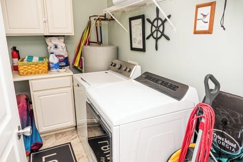 Laundry Room with washer and dryer and beach and sports gear