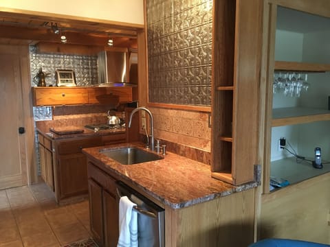 Granite and stainless steel in living room.