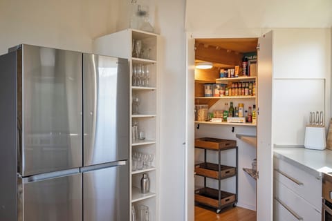 Modern french door refrigerator and freezer.  Large walk in pantry.