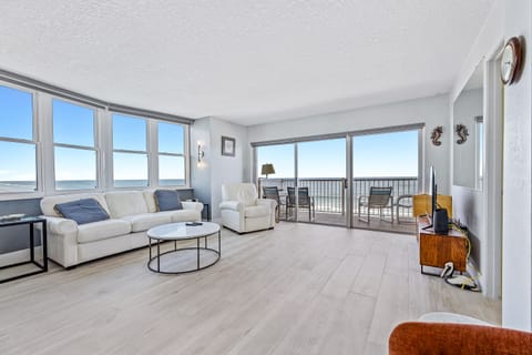 Enjoy the views from the oceanfront living room featuring a flat-screen TV, VCR, DVD player, and sofa sleeper.