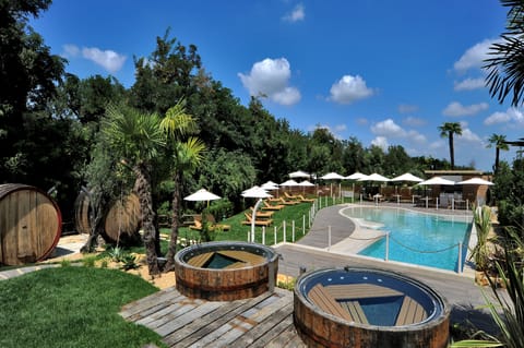 Seasonal outdoor pool, open 9:30 AM to 7:30 PM, pool umbrellas