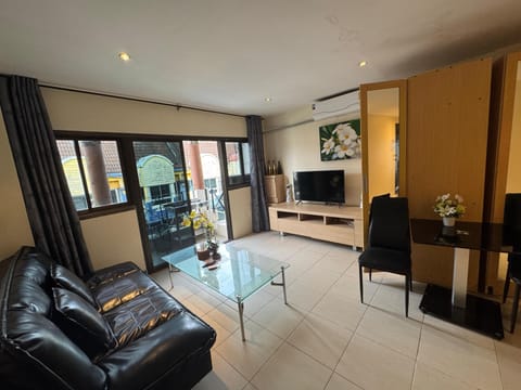 City Apartment, 1 Bedroom | Living area | 32-inch LED TV with cable channels, DVD player