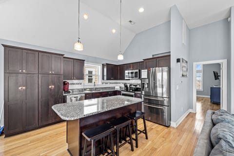 Kitchen with Bar Seating on Third Level