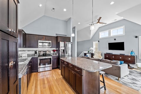 Kitchen with Bar Seating on Third Level