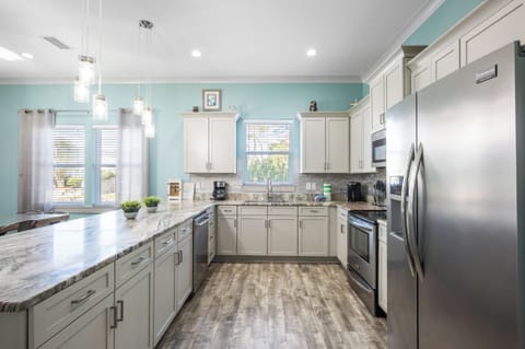 Modern, upscale kitchen comes fully equipped.