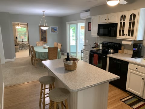 Kitchen & Dining Room looking into back family room/ 4th bedroom