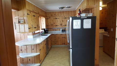 Kitchen with new quartz counter tops and stainless steel applianced