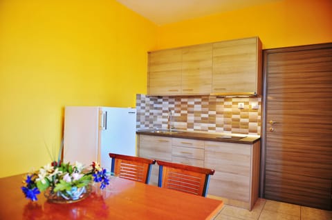 Family Apartment, 2 Bedrooms, Sea View | Private kitchenette | Microwave, stovetop, highchair, cookware/dishes/utensils