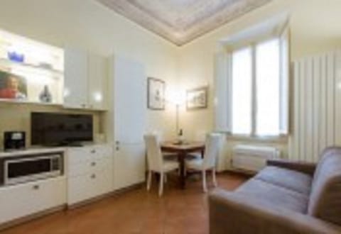 Apartment, 1 Bedroom | Living area | 32-inch TV with digital channels