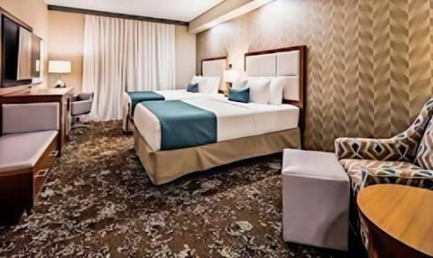 Pillowtop beds, desk, blackout drapes, iron/ironing board