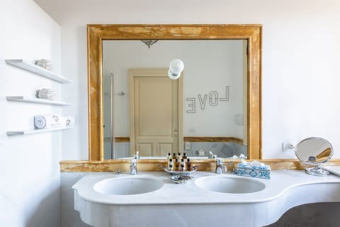 Junior Suite (French balcony) | Bathroom | Shower, free toiletries, hair dryer, slippers